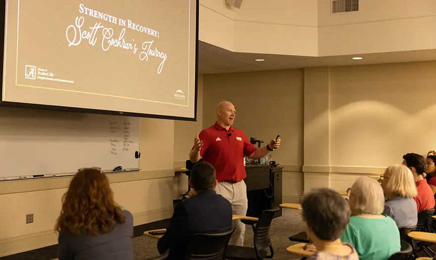 Scott Cochran presenting at a Collegiate Recovery and Intervention Service fundraiser