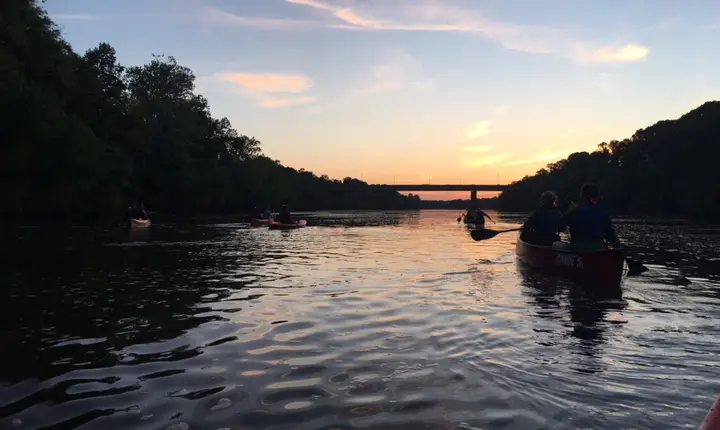 CRC students kayaking on the river at sunset